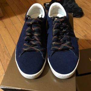 Blue Gucci sneakers reflect
